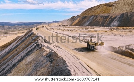 Process of transporting and dumping excavated mine material into leaching pads