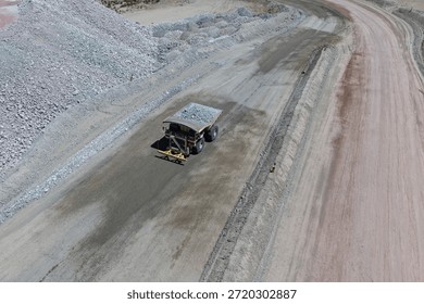 Process of transporting overburden materials to mine dumps using giant mining trucks