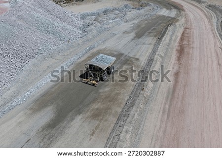 Process of transporting overburden materials to mine dumps using giant mining trucks