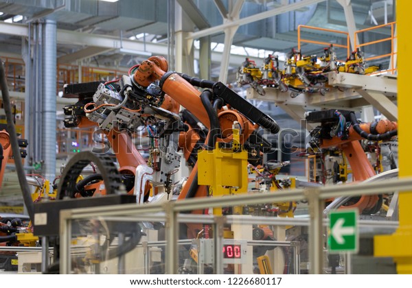 process of welding cars. Modern\
Assembly of cars at plant. automated build process of car\
body