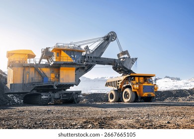 Process work on open pit mine with big truck, sunlight.