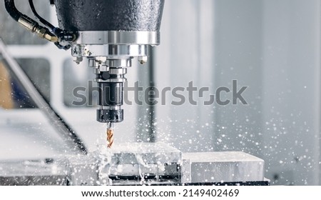 Process working CNC turning cutting milling metal Industry machine iron tools with splash water.