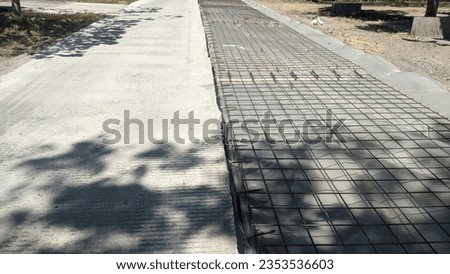 The process of working on the rigid pavement on the concrete side has been completed, the iron on the right side has just been installed.