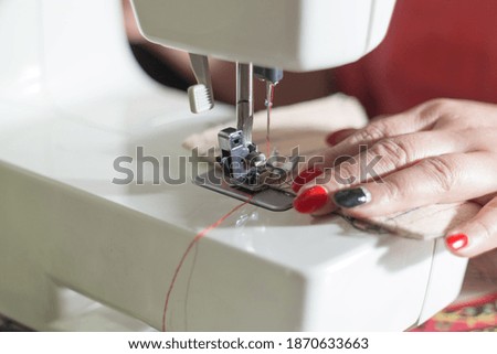 the process of working on a sewing machine. close-up.