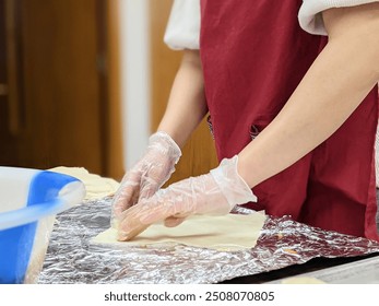 The process of wrapping egg rolls - Powered by Shutterstock