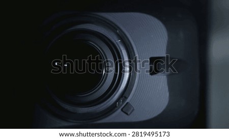 Process of Zooming Camera Lens, macro shot. Camera Lens Photographing. a Camera Lens with Flare on Optical Glass. Camera Lens Focal Change, close up.