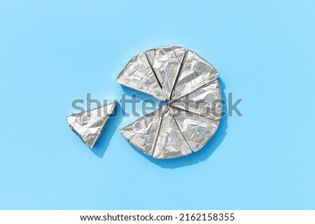 Processed cheese on blue background with deep long shadows. Minimal creative food concept