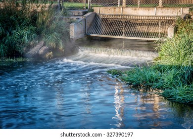 Processed And Cleaned Sewage Flowing Out From Water Reclamation Facility To A River