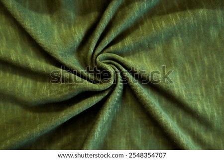 Processed collage of smooth elegant wavy deep Green cotton cloth fabric material texture. Background for banner, backdrop or texture 