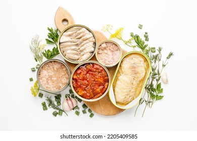 Processed fish in tins, canned seafood on a white background.