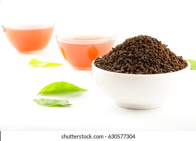 Processed granulated tea in white bowl.
