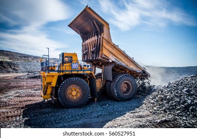 Processes of extraction of iron ore in mine - Shutterstock ID 560527951