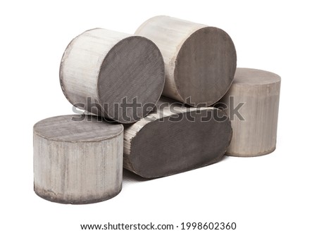 Processing and acceptance of non-ferrous metals. Six round and oval ceramic catalysts containing platinum, palladium and rhodium on a white background.