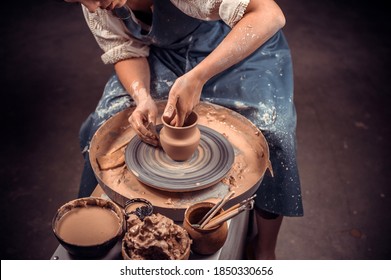 Processing clay ware and making dishes, process. Ceramics of handwork and clay ware on the potter's wheel.