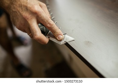 
processing the edges of a wooden part with a carpentry knife before manufacturing - Powered by Shutterstock