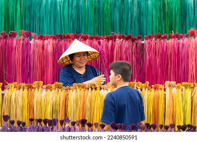 Processing of flax trees into different colors to be weaved into mats. One of the occupations and lifestyles of village people in rural Thailand.