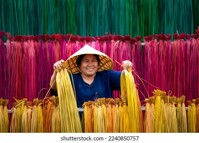 Processing of flax trees into different colors to be weaved into mats. One of the occupations and lifestyles of village people in rural Thailand.