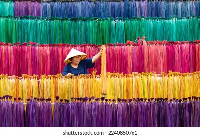 Processing of flax trees into different colors to be weaved into mats. One of the occupations and lifestyles of village people in rural Thailand.
