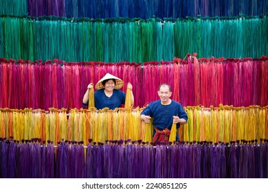 Processing of flax trees into different colors to be weaved into mats. One of the occupations and lifestyles of village people in rural Thailand.