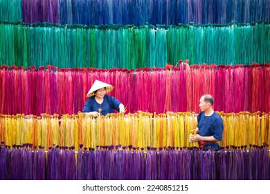 Processing of flax trees into different colors to be weaved into mats. One of the occupations and lifestyles of village people in rural Thailand.