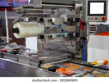 Processing of Packaging of meat ball and sausage on food vacuum packaging sealing machine in food industrial factory
