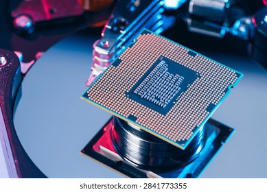 processing unit CPU microprocessor chip placed on opened computer hard disk drive HDD components as a conceptual metaphor for AI hardware semiconductor technology data storage infrastructure and cyber