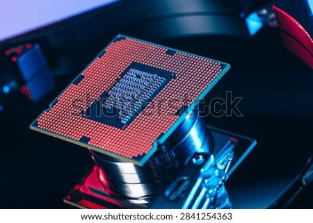 processing unit CPU microprocessor chip placed on opened computer hard disk drive HDD components as a conceptual metaphor for AI hardware semiconductor technology data storage infrastructure and cyber