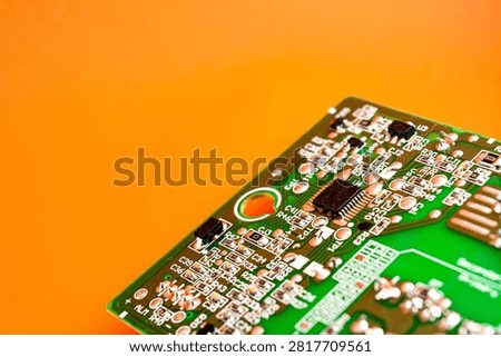 Processor Chipset in electronic circuit board with orange color background 