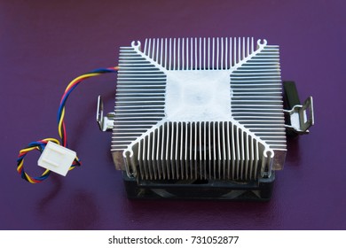The processor cooler is old on a dark background