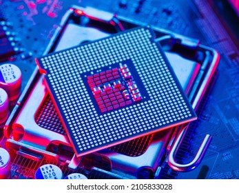 Processor, microprocessor on the motherboard. Blue neon lighting. New engineering computer technologies, components of a personal computer, laptop, digital equipment. - Powered by Shutterstock - Get 15% off with code: PIKWIZARD15