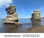 Procida - August 21st 2024: Stone stacks on Sunset Beach, Procida Island, Italy