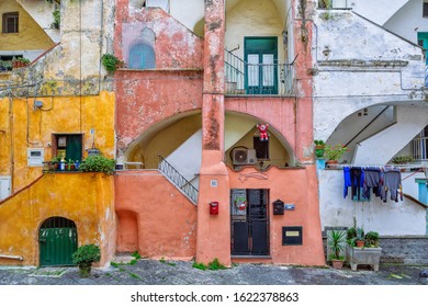PROCIDA, ITALY - JANUARY 4, 2020 - The “Casale Vascello” is  a traditional colored courtyard surrounded by tall terraced houses in "Terra Murata", Procida.