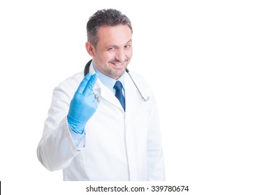 proctologist-showing-two-fingers-surgical-260nw-339780674.jpg