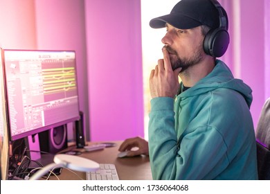 Producer Working In Sound Design Studio. Music, Film Score, Advertising Footage Digital Editing, Jingle Song, Voice Actor Recording, Post Production. Young Man Working With His Computer. Home Work