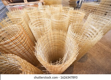 Producing fiberglass rods - manufacture of composite reinforcement, industry for construction. Composite Rebars. Reinforcing cage. Fiberglass reinforcement. composite rebar in roll