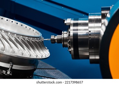 Producing turbine wheel part with five-axis lathe machine - Shutterstock ID 2217398657