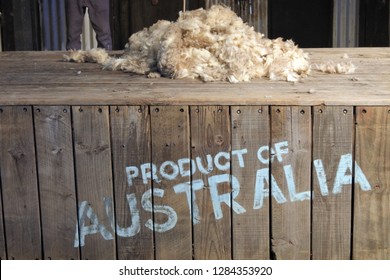 Product Of Australia Sign On A Wooden Box With Sheep Wool On Top Of It. No People. Copy Space