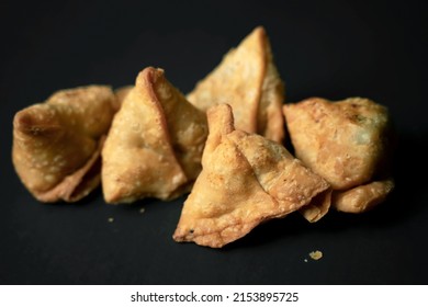 Product Photography Of Samosas In A Black Seem Less Background