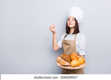 Product rack seller advertising offer appetite delicious enjoy people professional concept. Portrait of delightful excited peaceful with closed eyes girl promoting products isolated on gray background - Powered by Shutterstock