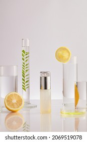 Product Research And Production Of Citrus Extract In A Laboratory With Medical Devices On A White Background. Blank Label Bottles For Design