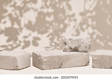 Product setting podium broken stone slabs, Piece of brick pedestal platform In the shade of a tree, rough textured blocks object placement, Matches beige in desert locations. - Shutterstock ID 2052479591