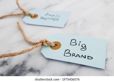 Product Tags With Small Business Vs Big Brand Texts With Focus On The Big One, Concept Of Customer Behaviour And Supporting Businesses