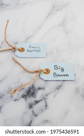 Product Tags With Small Business Vs Big Brand Texts With Focus On The Big One, Concept Of Customer Behaviour And Supporting Businesses