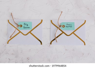 Product Tags With Small Business Vs Big Brand Texts Over Newsletter Email Envelopes, Concept Of Customer Behaviour And Supporting Small Local Businesses