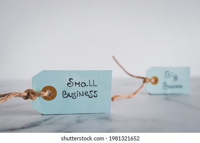 Product Tags With Small Business Vs Big Brand Texts Side By Side Sho At Shallow Depth Of Field, Concept Of Customer Behaviour And Supporting Small Businesses