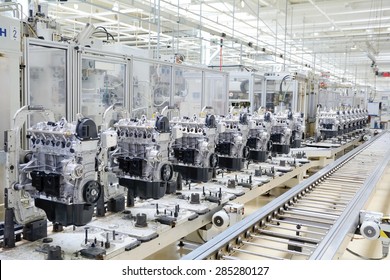 Production Assembly Line For Manufacturing Of The Engines In The Car Factory. Car Factory. Car Parts. Engine Factory. New Engine Factory. Engines On Line.