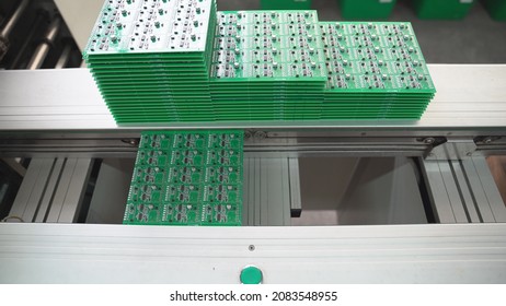 Production of high techonology circuit board. Close up making circuit board.