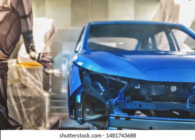 Production line of automobile plant, paint shop. Car body after applying the base paint. - Powered by Shutterstock