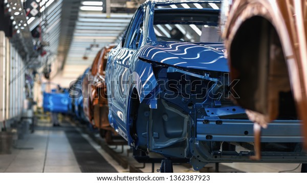 Production line of automobile plant, paint shop,\
conveyor. Finished\
product