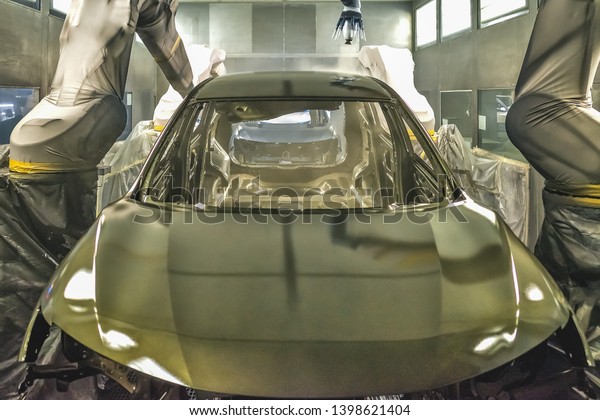Production line of automobile plant, paint
shop. Car body after applying the base
paint.
